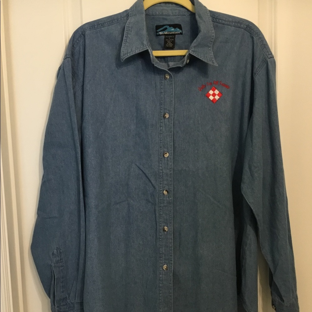Women’s L denim shirt with quilt show embroidery.
